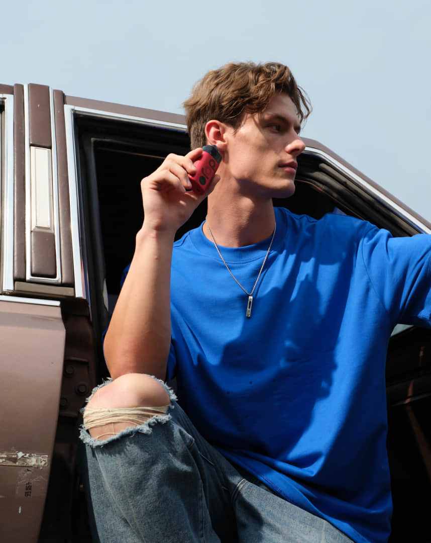 A man holds a vapor
